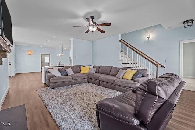 4333 US-117 Hwy, Wilson, NC 27893 - living area featuring wood finished floors, ceiling fan, stairs, baseboards, and recessed lighting