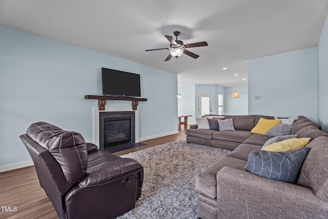 4333 US-117 Hwy, Wilson, NC 27893 - living area featuring wood finished floors, ceiling fan, a fireplace with flush hearth, baseboards, and recessed lighting