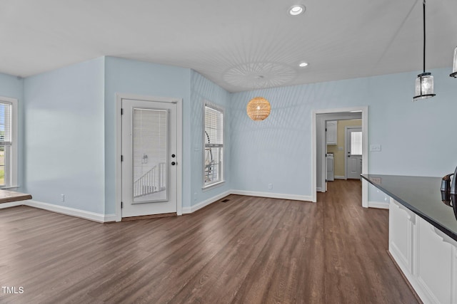 4333 US-117 Hwy, Wilson, NC 27893 - unfurnished living room featuring dark wood-style flooring, recessed lighting, and baseboards