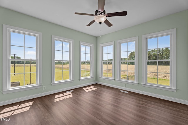 4333 US-117 Hwy, Wilson, NC 27893 - unfurnished sunroom featuring healthy amount of natural light, baseboards, and wood finished floors