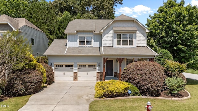 5545 Moneta Ln, Apex, NC 27539 - craftsman house featuring board and batten siding, concrete driveway, a front yard, and a porch