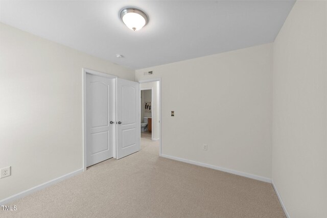 5545 Moneta Ln, Apex, NC 27539 - unfurnished bedroom with light carpet and baseboards