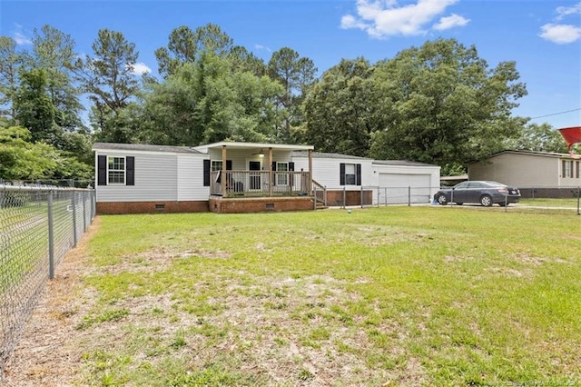 566 Quail Run Rd, Lumberton, NC 28358 - manufactured / mobile home featuring a porch, crawl space, and a detached garage