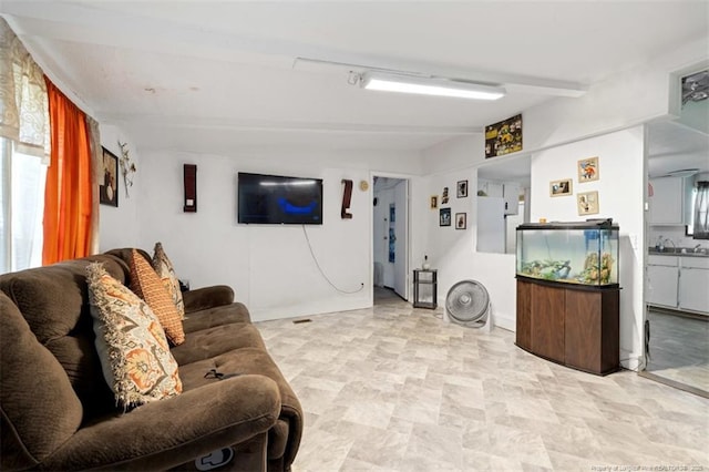 566 Quail Run Rd, Lumberton, NC 28358 - living room featuring beamed ceiling