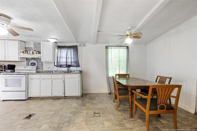 566 Quail Run Rd, Lumberton, NC 28358 - kitchen with white range with electric stovetop, a ceiling fan, and plenty of natural light