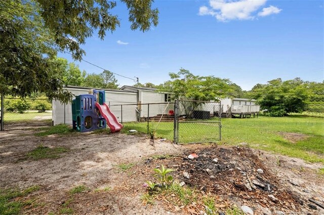 566 Quail Run Rd, Lumberton, NC 28358 - view of yard featuring a gate