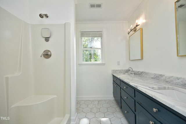 409 Glaive Dr, Durham, NC 27703 - full bath with double vanity, tile patterned floors, crown molding, and a shower