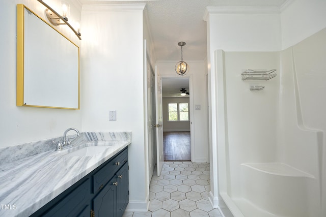 409 Glaive Dr, Durham, NC 27703 - full bath with vanity, tile patterned floors, ornamental molding, a shower, and ceiling fan