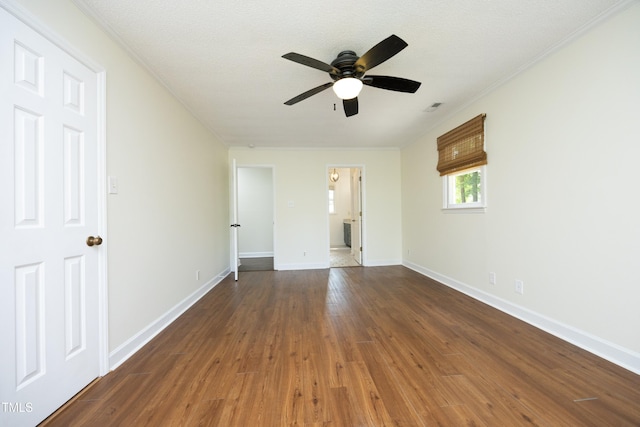 409 Glaive Dr, Durham, NC 27703 - unfurnished bedroom with wood finished floors, ornamental molding, and a ceiling fan
