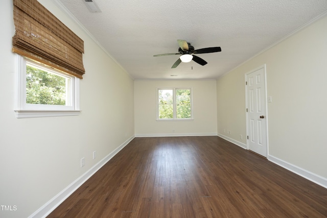 409 Glaive Dr, Durham, NC 27703 - empty room with ceiling fan, dark wood-type flooring, crown molding, and a textured ceiling