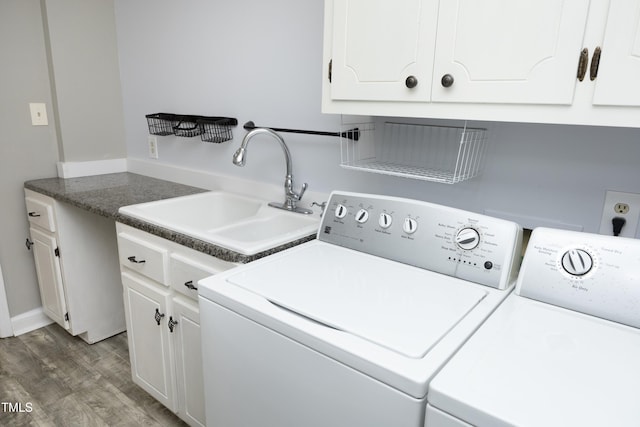 409 Glaive Dr, Durham, NC 27703 - washroom with washer and clothes dryer, cabinet space, and light wood-style flooring