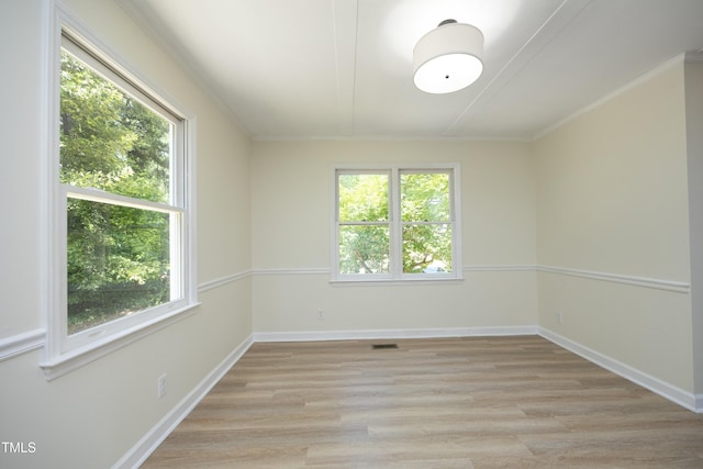 409 Glaive Dr, Durham, NC 27703 - unfurnished room featuring light wood-style flooring and crown molding