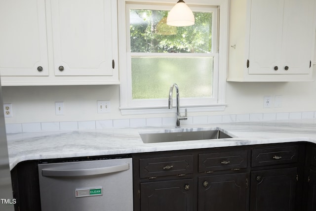 409 Glaive Dr, Durham, NC 27703 - kitchen with white dishwasher, white cabinetry, and dark cabinetry