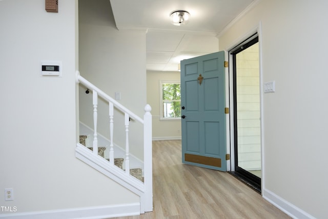 409 Glaive Dr, Durham, NC 27703 - entrance foyer with light wood-type flooring, ornamental molding, and stairs