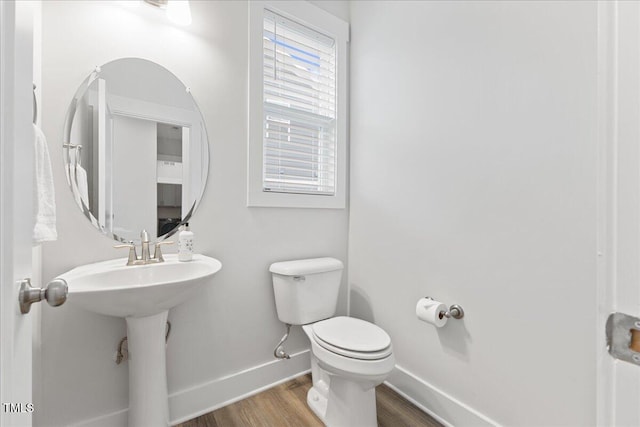 857 Whistable Ave, Wake Forest, NC 27587 - bathroom with baseboards, wood finished floors, and toilet