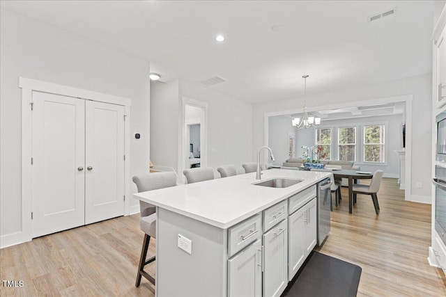 857 Whistable Ave, Wake Forest, NC 27587 - kitchen with a sink, a breakfast bar area, light wood-style floors, stainless steel appliances, and recessed lighting