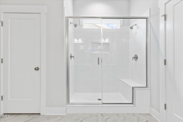 857 Whistable Ave, Wake Forest, NC 27587 - bathroom featuring marble look tiles, a shower stall, and baseboards