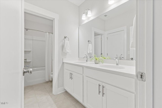 857 Whistable Ave, Wake Forest, NC 27587 - full bathroom featuring double vanity, shower / bath combo, tile patterned flooring, and toilet