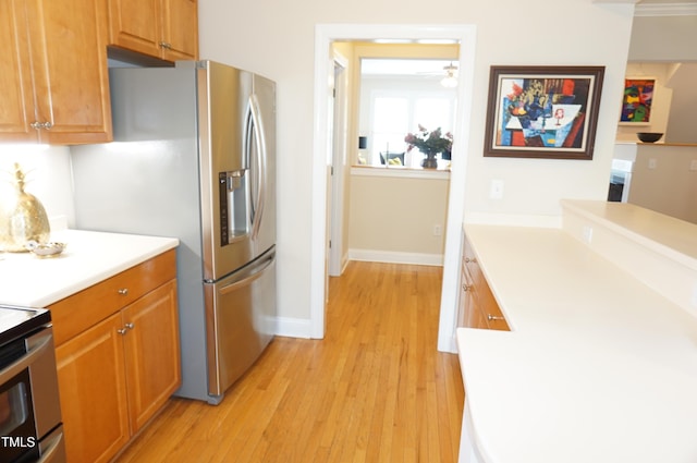 4810 Glenmist Ct, Raleigh, NC 27612 - kitchen featuring stainless steel fridge with ice dispenser, light wood-style floors, light countertops, baseboards, and brown cabinets