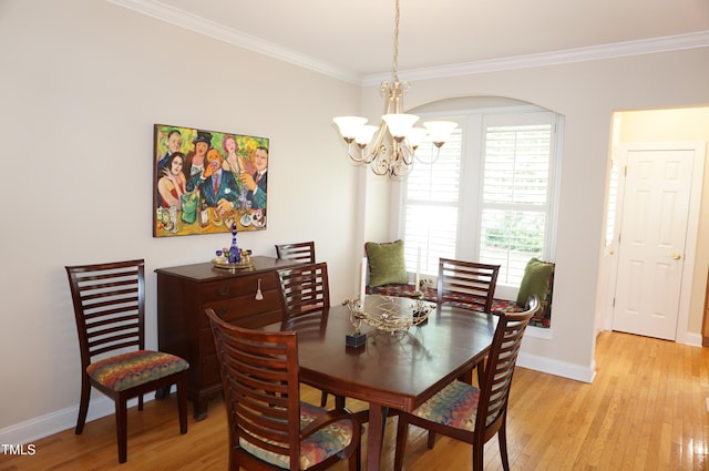 4810 Glenmist Ct, Raleigh, NC 27612 - dining room featuring a chandelier, ornamental molding, light wood finished floors, and baseboards