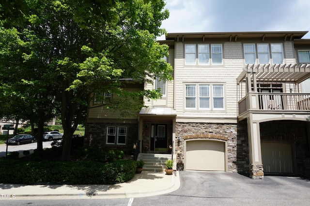 4810 Glenmist Ct, Raleigh, NC 27612 - view of front of home featuring an attached garage, stone siding, driveway, and a pergola