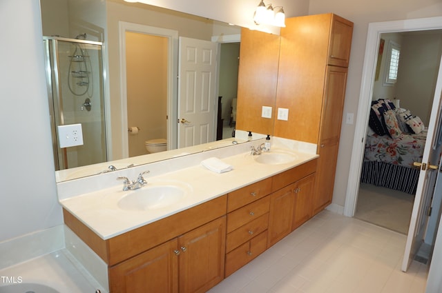 4810 Glenmist Ct, Raleigh, NC 27612 - full bathroom with toilet, double vanity, a stall shower, and tile patterned flooring