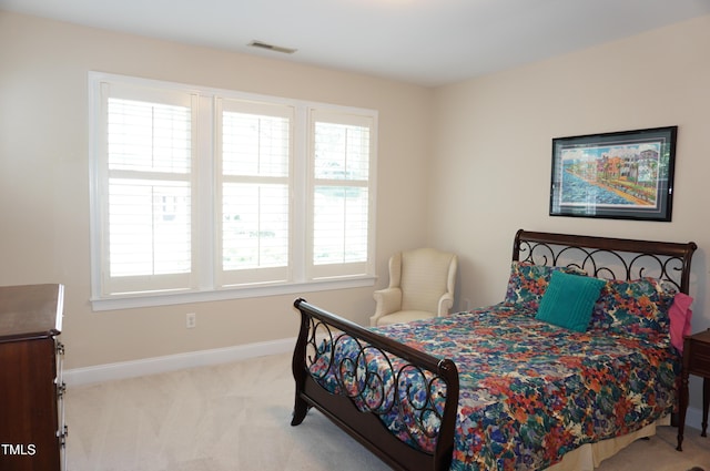 4810 Glenmist Ct, Raleigh, NC 27612 - carpeted bedroom with multiple windows and baseboards
