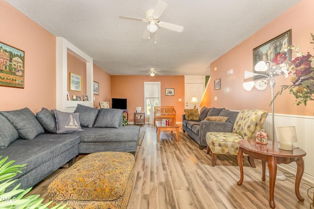 713 Saint Catherines Dr, Wake Forest, NC 27587 - living area with a ceiling fan, a textured ceiling, and light wood-style flooring