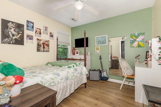 713 Saint Catherines Dr, Wake Forest, NC 27587 - bedroom featuring wood finished floors and a ceiling fan