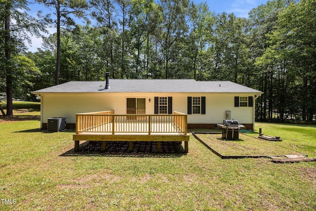 117 Lema Dr, Garner, NC 27529 - rear view of property with central AC unit, a wooden deck, and a lawn