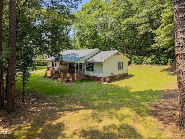 117 Lema Dr, Garner, NC 27529 - back of house with covered porch, crawl space, and a lawn