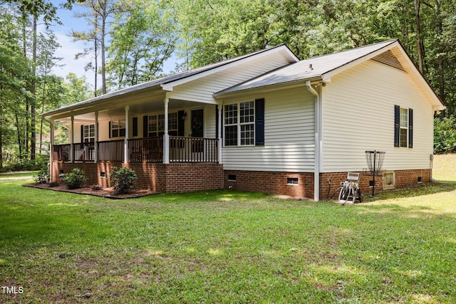 117 Lema Dr, Garner, NC 27529 - view of home's exterior with crawl space, a porch, and a yard