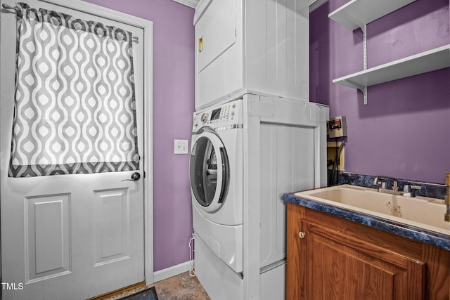 117 Lema Dr, Garner, NC 27529 - washroom with stacked washer / drying machine and baseboards