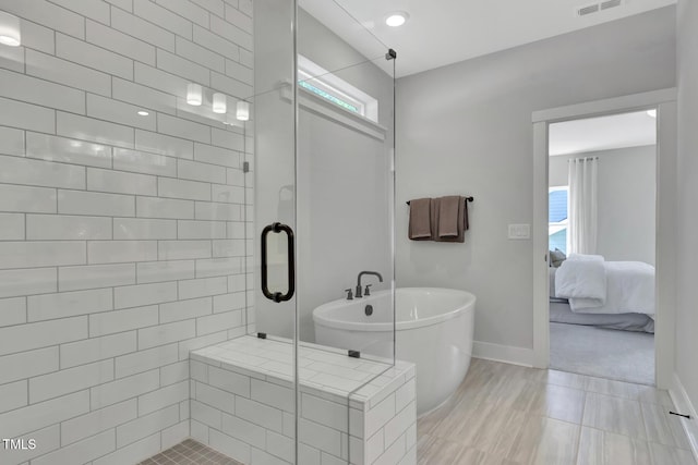 1100 Balsawood Dr Unit 5, Durham, NC 27705 - full bathroom featuring a stall shower, a freestanding bath, ensuite bathroom, and baseboards