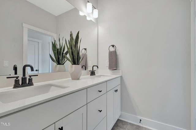 1100 Balsawood Dr Unit 5, Durham, NC 27705 - bathroom featuring double vanity, baseboards, and tile patterned flooring