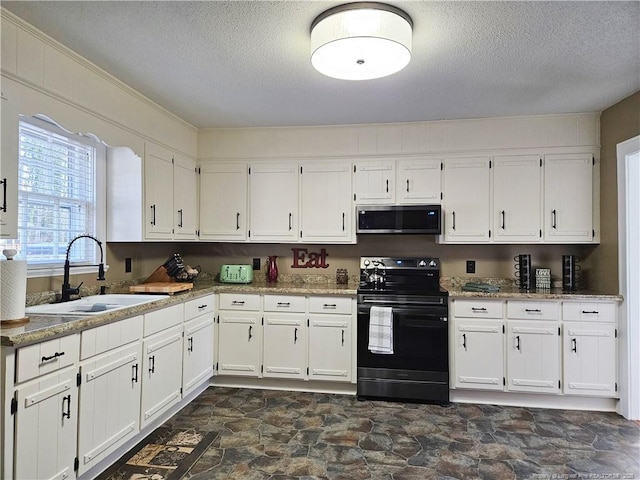 3647 Olivia Rd, Sanford, NC 27332 - kitchen featuring stainless steel microwave, black electric range oven, a sink, dark stone finish floors, and a textured ceiling