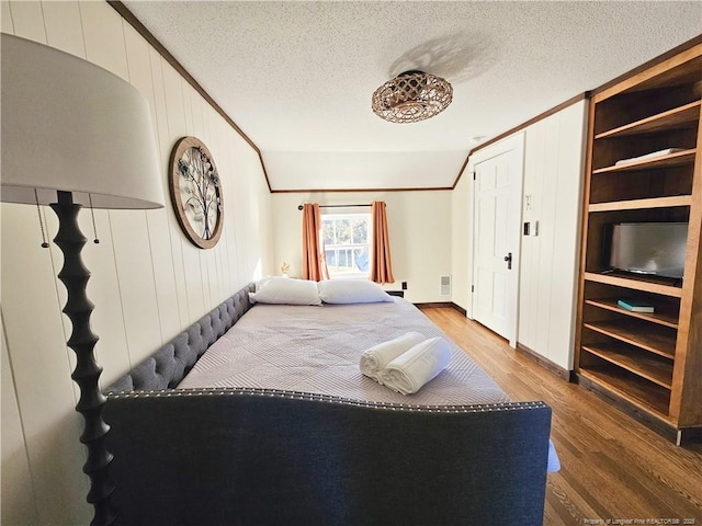 3647 Olivia Rd, Sanford, NC 27332 - bedroom featuring ornamental molding, wood finished floors, and a textured ceiling