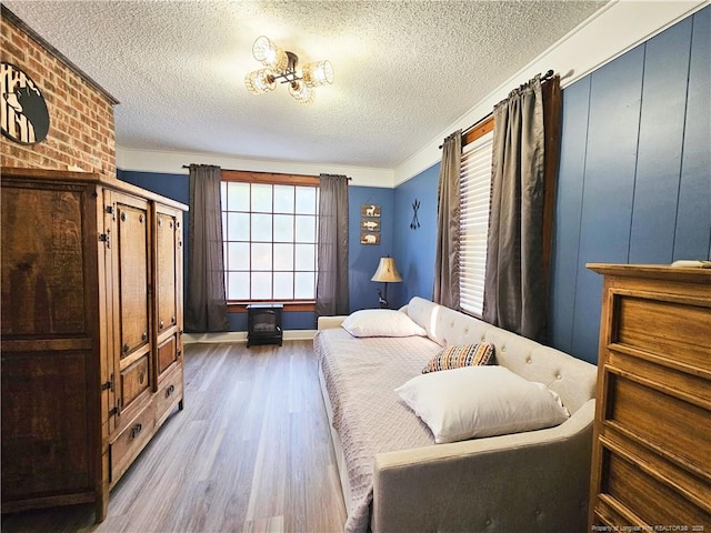 3647 Olivia Rd, Sanford, NC 27332 - bedroom with wood finished floors and a textured ceiling