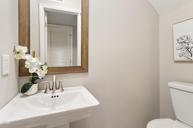 118 Rhum Pl, Garner, NC 27529 - half bathroom featuring toilet and a sink