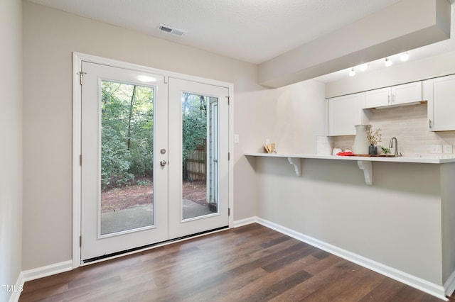 118 Rhum Pl, Garner, NC 27529 - doorway to outside featuring dark wood-style flooring, french doors, baseboards, and a sink