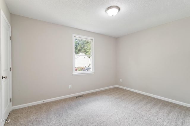 118 Rhum Pl, Garner, NC 27529 - spare room with carpet floors, baseboards, and a textured ceiling
