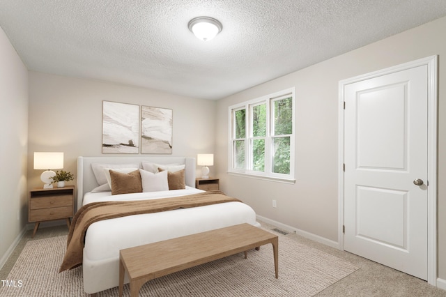 118 Rhum Pl, Garner, NC 27529 - bedroom with light carpet, baseboards, and a textured ceiling