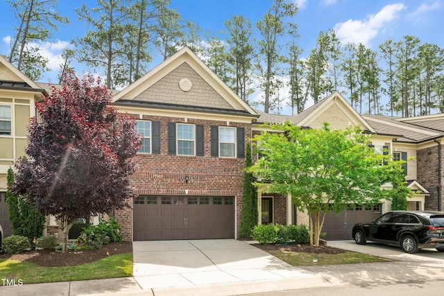 329 Castle Rock Ln, Cary, NC 27519 - view of front of home featuring driveway, brick siding, and a garage