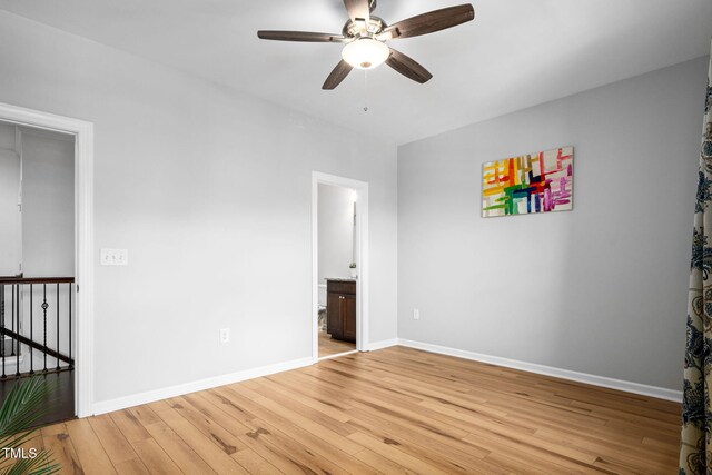329 Castle Rock Ln, Cary, NC 27519 - unfurnished room with a ceiling fan and light wood finished floors