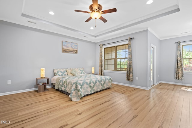 329 Castle Rock Ln, Cary, NC 27519 - bedroom featuring a tray ceiling, light wood finished floors, recessed lighting, crown molding, and a ceiling fan