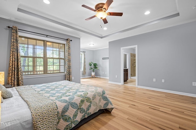 329 Castle Rock Ln, Cary, NC 27519 - bedroom with a tray ceiling, crown molding, light wood finished floors, recessed lighting, and a ceiling fan
