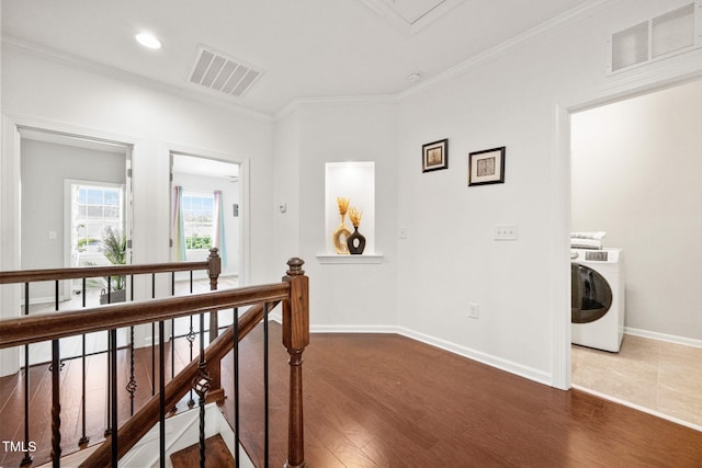 329 Castle Rock Ln, Cary, NC 27519 - hallway featuring washer / clothes dryer, an upstairs landing, wood finished floors, crown molding, and recessed lighting