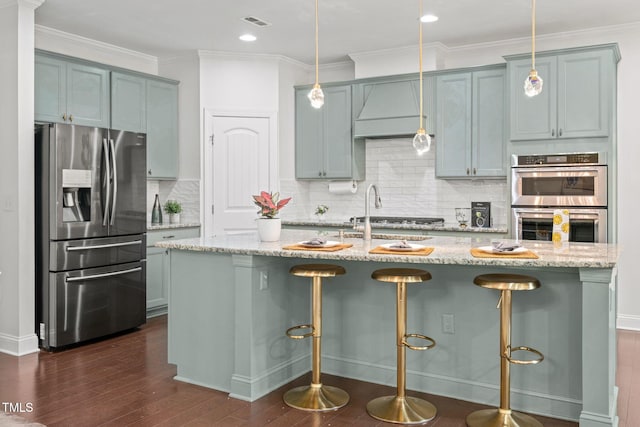 329 Castle Rock Ln, Cary, NC 27519 - kitchen with appliances with stainless steel finishes, custom range hood, dark wood-type flooring, backsplash, and light stone countertops