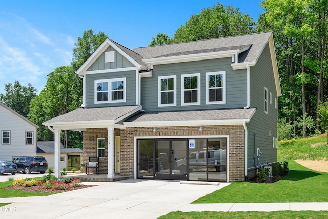 134 Beacon Dr, Pittsboro, NC 27312 - view of front facade featuring brick siding, concrete driveway, and a shingled roof
