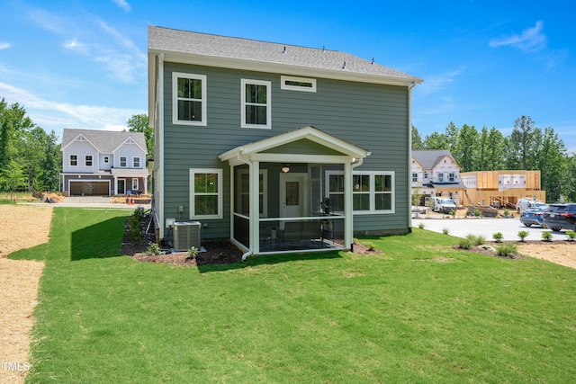 134 Beacon Dr, Pittsboro, NC 27312 - rear view of property featuring a sunroom, central AC unit, and a yard